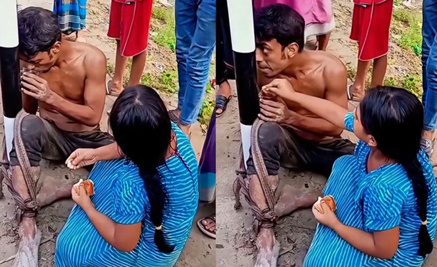 চুরির অভিযোগে খুঁটির সঙ্গে বাঁধা বাবা, ক্ষুধার্ত বাবার মুখে রুটি তুলে দিচ্ছে ছোট্ট মেয়ে 